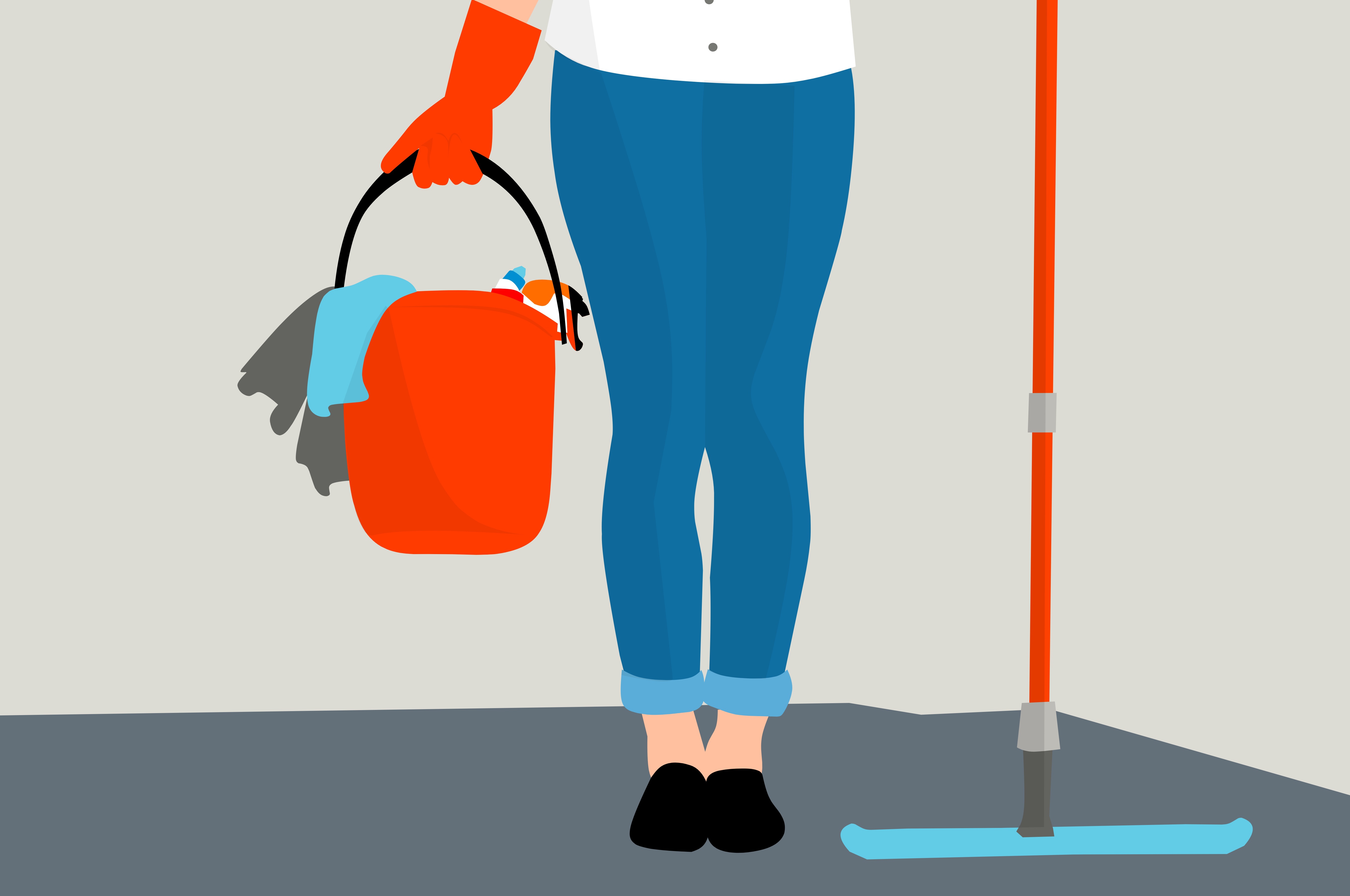 A housekeeper holding a mop